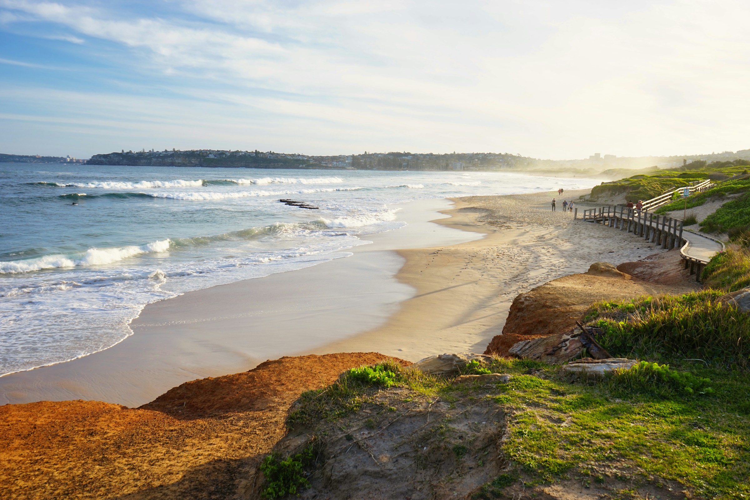 Coastline with green dunes at golden hour